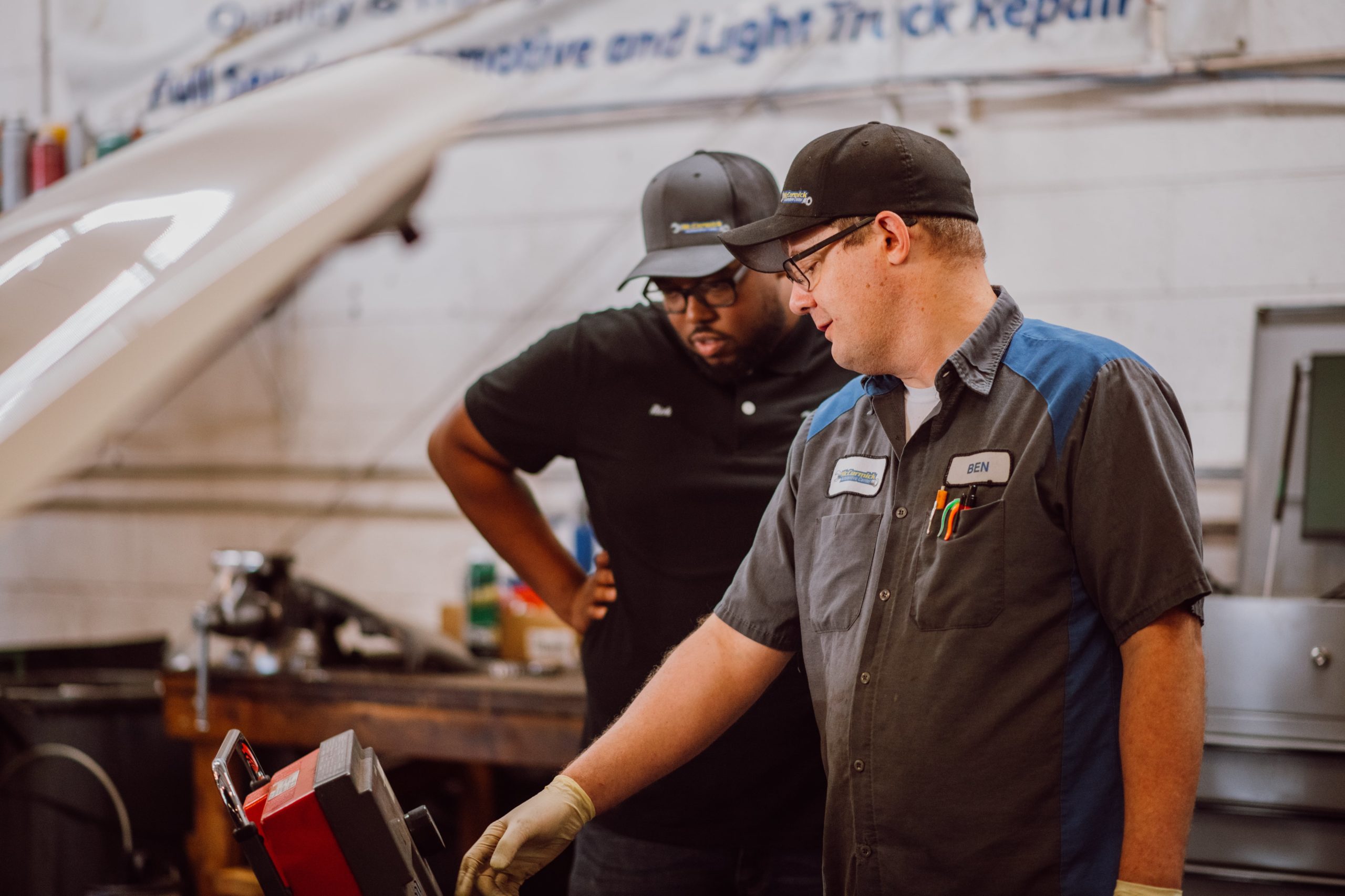 Photo of Mechanics Looking at Car at McCormick Automotive Center in Fort Collins, Colorado